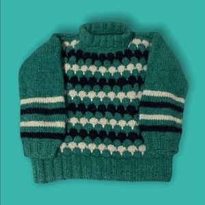 Green crew neck pull over with black & white pattern